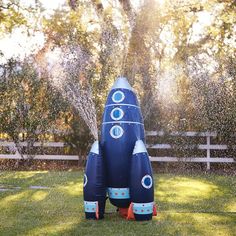 an inflatable rocket is sprinkled with water