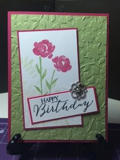 a happy birthday card with flowers on it