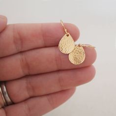 These classic and simple everyday earrings are made from 100% 14k gold-filled metal, including ear wires and pear shaped drop charms. They are teardrop shaped and available in a hammered shiny finish. 14k gold filled french hook ear wires with a tiny ball at the top. * Small 13mm x 10mm sterling silver or 14k gold-filled teardrops *Hammered shiny finish, unless otherwise specified * French hook ear wires with tiny ball at the top GOLD FILLED Gold filled has 100x the gold content of gold-plated a Gold Teardrop Earrings, Hammered Earrings, Everyday Earrings, Earrings Sterling Silver, Teardrop Earrings, Fine Silver, Pear Shaped, Gold Filled, Etsy Earrings