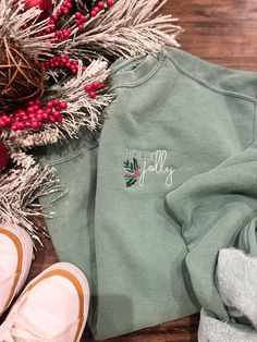 Holly Jolly Embroidered Green Comfort Colors Sweatshirt This is made to order green-colored Comfort Colors sweatshirt. It includes an embroidered Holly jolly image as pictured on the left chest.  This design can be offered on different color sweatshirts, long sleeve t-shirts, etc in different sizes. Message with details on what you would like or drop your request in the customization box! I'll do my best to accommodate.  *If you have something different in mind we love doing custom orders and wh Hand Embroidered Christmas Sweatshirt, Christmas Embroidery Sweatshirts, Embroidered Holly, Diy Christmas Lights, Christmas Embroidery Designs, Comfort Colors Sweatshirt, Green Sweatshirt, Embroidery Sweatshirt, Holiday Sweatshirt