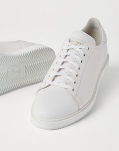 Grained calfskin sneakers These sneakers combine a classic slim and essential design with fine materials and skillful craftsmanship. The refined texture of grained calfskin, featuring an uneven effect, enhances the vintage feel of the shoe. Comfort is guaranteed by a lightweight rubber sole. Luxury Calf Leather Sneakers With Stitched Sole, Elegant Low-top Calf Leather Sneakers, Elegant Low-top Sneakers With Stitched Sole, Elegant Low-top Sneakers With Perforated Toe Box, Elegant Calf Leather Sneakers With Textured Sole, Fashionable Sneakers With Contrast Sole And Calf Leather, Elegant Sneakers With Contrast Sole And Calf Leather, Luxury Sneakers With Leather Sole And Plain Toe, Elegant Low-top Custom Sneakers In Calf Leather