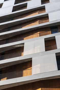 an apartment building with balconies on the sides