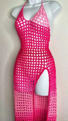 a mannequin is wearing a pink dress with an open back and cut out sides