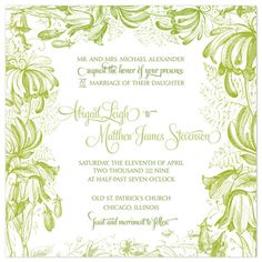 a wedding card with green and white flowers on the front, in an ornate frame