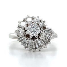 an antique style diamond ring with baguetts set in white gold