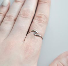 This sterling silver ocean wave ring looks great on its own or in a stack. Pair them with birthstone rings and you have a stylish way to keep your loved ones close even when they're far away. Rings are only sold in sizes 5 6 7 8 9 10 ..........PRODUCT DETAILS• Ring is solid 925 sterling silver • Width of band measures 1mm • Wave face height is 6mm• Comes beautifully packaged in a gift box..........SHIPPING and POLICIES• Orders are made and shipped within 3-5 business days. See listing photos for Beach Rings, Ocean Ring, Women's Equestrian, Silver Rings For Women, Horseshoe Ring, Birthstone Rings, Equestrian Jewelry, Wave Ring, Detailed Ring