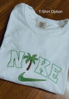 Palm Tree Crewneck/T-Shirt – Rags Revived Nike Palm Tree Sweatshirt, Trendy Cotton Crew T-shirt, White Embroidered T-shirt For College, White Cotton Crew T-shirt, White Screen Print Sweatshirt For Summer, White Embroidered Graphics T-shirt For College, Trendy Cotton Crew Neck T-shirt, White Relaxed Fit T-shirt With Embroidered Graphics, White Pre-shrunk Sweatshirt For Streetwear