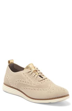 Perforated detailing and a lace-up style complements this oxford. Wingtip toe Lace-up style Back pull-tab Manmade upper and sole Imported Casual Beige Wingtip Oxfords, Elegant Lace-up Oxfords With Perforations, Casual Beige Oxfords, Elegant Lace-up Sneakers With Perforations, Spring Lace-up Oxfords With Perforated Toe Box, Elegant Lace-up Sneakers For Spring, Spring Lace-up Oxfords With Laces, Loafer Shoes Women, Wingtip Oxford