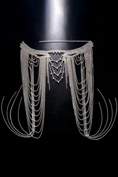 Drape yourself in elegance with our Multilayer Sparkling Fringe Shoulder Chain. This exquisite accessory is a symphony of shimmering brilliance, featuring multiple layers of dazzling rhinestones that gracefully cascade down your shoulder. The delicate tassels add a touch of movement and drama, ensuring you stand out at any glamorous event. Elevate your look and exude sophistication with this statement shoulder chain, perfect for adding a touch of opulence to your ensemble. Glamorous Festival Jewelry With Chain Detail, Elegant Double Chain Body Chain For Party, Adjustable Silver Elegant Waist Chain, Silver Rhinestone Fringe Evening Jewelry, Glamorous Silver Body Chain With Adjustable Chain, Silver Rhinestone Crystal Necklace For Festival, Festival Silver Body Jewelry With Rhinestones, Silver Jewelry With Rhinestone Fringe For Evening, Silver Rhinestone Body Jewelry For Festivals