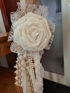 a bridal bouquet with pearls and lace