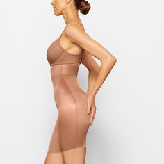 The perfect light-compression shapewear short style for underneath skirts and dresses. It’s made with double-layered fabric, a thin waistband, and raw c... Mid Thigh Shorts, Skirts And Dresses, And Dresses, Shapewear, Dress Skirt, Fabric, Dresses