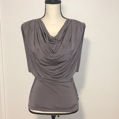 This Is A Never Worn L.A.M.B. Sleeveless Cowl Neck Top In Medium Gray. It’s Made Of Rayon And Elastane Making It Stretchy And Form Fitting. It Looks Great Alone Or Under A Cool Jacket. ***Please Note That There Is A Small Tear In The Cowl Area, Which I Had Never Noticed Until Taking The Pics Up Close. It Can Be Seen In The Last Pic. Elegant Sleeveless Gray Tops, Chic Gray Tank Top, Lamb Gwen Stefani, Silk Sleeveless Top, Draped Blouse, Plaid Vest, Silk Tunic, High Neck Sleeveless, Blouse Short Sleeve