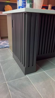 a kitchen counter with an ice bucket on top