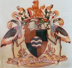 a coat of arms with two birds on it