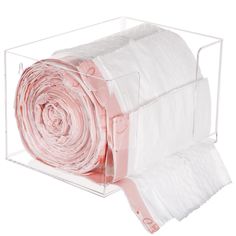 clear acrylic storage box with pink and white cloths in the bottom section