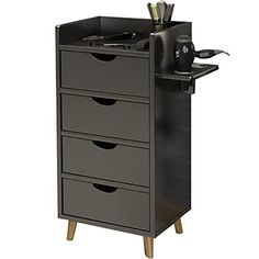 a black cabinet with drawers and tools in it