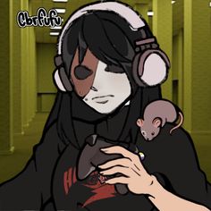 a woman with headphones on holding a small rat in her lap and looking at the camera