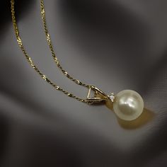 "Cultured pearl and diamond accent pendant necklace in solid 14k gold. This estate find beautifully graces the neck with a sophisticated miminalist design. The cream color genuine pearl is 7.5 mm and has beautiful luster. The sparkling  diamond accent is clear and prong-set. The 20-inch 14k gold twisted double serpentine chain, a.k.a. tinsel chain, is beautiful alone as well as with pendant.  Marked 14k gold and also tested 14k gold. The beautiful 20\" chain is also solid 14k gold.  Pearl: 7.5 m Elegant Yellow Gold Pear-shaped Pearl Necklace, Elegant Pear-shaped Yellow Gold Pearl Necklace, Gold Akoya Pearl Necklace With Diamond Accents, Pearl Diamond Necklace, Pearl And Diamond Necklace, Pearl And Diamond Earrings, 20 Gifts, Sparkling Diamond, Pearl Diamond