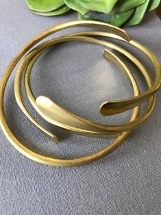 Set of 3 Golden Raw Brass Coil Cuffs - Stacking Set – The Cord Gallery Handmade Minimalist Brass Bangle, Gold Metal Bohemian Wrap Bracelet, Minimalist Handmade Brass Bangle, Bohemian Gold Metal Wrap Bracelet, Adjustable Bohemian Brass Cuff Bracelet, Bohemian Hand-wrapped Brass Cuff Bracelet, Adjustable Bohemian Brass Bangle, Minimalist Adjustable Brass Cuff Bracelet, Bohemian Hand Forged Cuff Bangle Bracelet