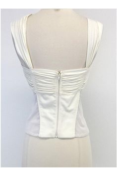 Size Large Cream Gathered Mesh Tank Retails for $1,295 Body 92% Viscose 8% Elastane Mesh insets 84% Nylon 16% Elastane Made in the USA Exposed back zip & clasp Silver buckle on waist Mesh inserts Cutouts under bust Comes w/original tags Bust 30" Waist 29.5" Total length 19.5" White Stretch Top With Boned Bodice, White Stretch Tops With Boned Bodice, Evening Tops With Boned Bodice For Spring, Chic White Top With Boned Bodice, White Boned Bodice Top For Evening, Chic White Tops With Boned Bodice, Ruched Formal Tops For Summer, Formal Ruched Tops For Summer, Elegant Spring Top With Boned Bodice