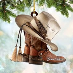 a cowboy boot ornament hanging from a christmas tree