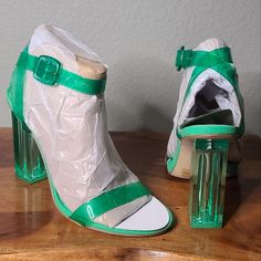 Gianni Bini, The Liyra Clear Ankle Strap Block Heel Sandals Clear Synthetic Upper Ankle Strap With Buckle Closure Unlined Memory Foam Sock Synthetic Outsole Approx. 3.93" Clear Heel Height One Size 7 Left Brand New In The Box Green Sandals With 4-inch Heel For Summer, Trendy Green Heels With Buckle Closure, Green Sandals With Heel Strap For Party, Green Synthetic Sandals With 4-inch Heel, Green Sandals For Spring Party, Green Ankle Strap Sandals For Party, Green High Heel Sandals For Party, Chic Green Heels With Buckle Closure, Party Sandals With Clear Ankle Strap