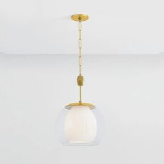 a light fixture with a glass ball hanging from it's end and a gold chain