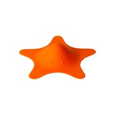 an orange star shaped object on a white background