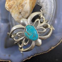 Vintage Native American Silver Turquoise Sandcast Bracelet For Women. Opening 1 3/4" Diameter 2 3/8" Circumference 5" (W/O The Gap) Width 1 3/4" Weighs 63.1 Grams ** Item Tested As Silver ** (Vpbr82ggu91) Adjustable Elegant Jewelry With Patina Detail, Elegant Adjustable Jewelry With Patina, Artisan Turquoise Jewelry For Formal Occasions, Elegant Turquoise Bracelet With Patina, Elegant Turquoise Bracelets With Patina, Elegant Turquoise Cuff Bracelet With Gemstone, Turquoise Bangle For Formal Occasions, Elegant Oval Jewelry With Patina, Formal Turquoise Bangle Jewelry