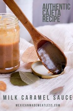 a wooden spoon with some food in it next to a jar filled with peanut butter