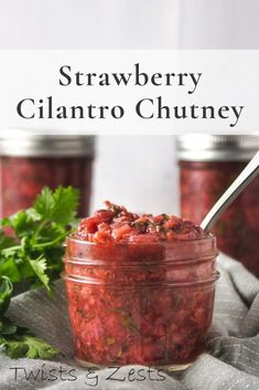 strawberry cilantro chutney in a jar with a spoon