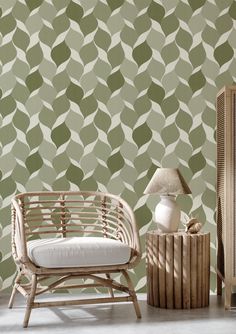 a chair and table in front of a wallpapered room with an abstract pattern