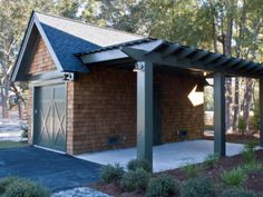 a small brick building with a pergolated roof in the middle of a park