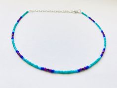 This beautiful beaded necklace is made with glass seed beads that fade from turquoise to blue to purple.  It comes in four different sizes - (14, 16, 18, and 20 inches) and every necklace also comes with three additional inches of extender chain.  This cool colors minimalist necklace goes well with so many outfits and also makes a great gift! Purple Colorful Beads Choker Jewelry, Purple Colorful Beaded Choker Jewelry, Adjustable Purple Choker With Colorful Beads, Purple Choker With Colorful Beads For Gift, Purple Beaded Choker Necklace, Purple Beaded Choker With Round Beads, Purple Beaded Necklace With Tiny Beads For Jewelry Making, Blue Beaded Choker With Tiny Beads, Blue Beaded Choker With Faceted Beads