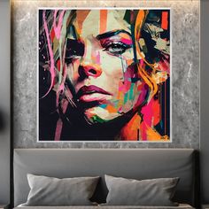 a painting on the wall above a bed in a room with grey walls and pillows