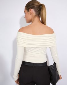 This classic top features a foldover off shoulder style, longline length and long sleeves. Chic Fitted Off-shoulder Long Sleeve Top, Fitted Chic Off-shoulder Top For Fall, Chic Fitted Off-shoulder Top For Fall, Chic Off-shoulder Long Sleeve Top For Winter, Fitted Long Sleeve Off-shoulder Top For Spring, Spring Off-shoulder Fitted Long Sleeve Top, Long Sleeve Off-shoulder Top For Fall Party, Fitted Boat Neck Winter Tops, Chic Fitted Long Sleeve Off-shoulder Top