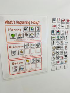 a white refrigerator freezer sitting next to a magnet board