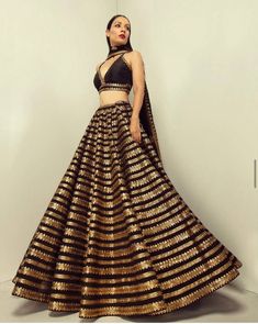 "✦We provide high quality Indian Ethnic wear for women. We house a wide range of collections of dresses, which include the designer lehenga choli ,bridesmaid lehenga choli,festival lehenga choli,latest gowns, party wear Lehenga Choli,indian wedding lehengas,ready made lehenga,sabiyasachi lehengas,bollywood designer outfits and many more. 👉Lehenga choli Detail Lehenga (Semi-Stitched) Fabric:Heavy Kasturi silk Work:sequence & dori work ( 3 meter flair ) Flair : 3 mtr Size : waist-44\" Length- Golden Lehenga, Sequence Lehenga, Black Lehenga Choli, Dori Work, Blouse Lehenga, Indian Wedding Lehenga, Bridesmaid Lehenga, Saree Bollywood, Sabyasachi Lehenga