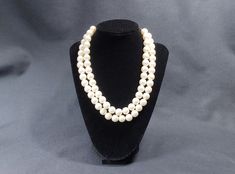 "Do you want the traditional look of a pearl necklace but don't want the hassle of caring for delicate pearls or worrying about losing an expensive strand of real pearls? This is a high quality 17\" long double strand faux pearl necklace that is comprised of beads with good and even luster, same sized/shaped beads and a gold tone clasp. This faux pearl necklace will make an wonderful addition to your jewelry box or will be a great Christmas gift! Approximate Measurements: Length: 17\" Beads: 10. Formal Double Strand Pearl Necklace With Pendant, Double Strand Pearl Necklace For Formal Occasions, Formal Double Strand Pearl Necklace, Classic Double Strand Necklace With Pearl Pendant, Formal Round Pearl Chain Beaded Necklace, Formal Beaded Necklace With Pearl Pendant, Formal Round Beaded Necklace With Pearl Charm, Classic Formal Pearl Chain Beaded Necklace, Formal Pearl Pendant Beaded Necklace