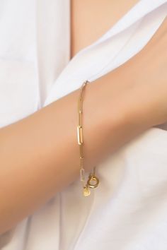 "Paperclip Chain 14k Solid Gold Bracelet, Rectangle Long Link Bracelet, Oval Link Chain Bracelet, Stylish Bracelet, Anniversary Gift its presence will make a difference on your wrist with its special design. It is suitable for daily use as well as for special occasions. More details; Our product is 2.85 gr in weight and 17 cm in length. Your products will be shipped with free shipping UPS express within 1-3 business days. All of our products has the stamp \"585\" on them. (which states that this Gold Oval Link Modern Charm Bracelet, Luxury Box Chain Bracelets For Anniversary, Gold Charm Bracelet With Rectangular Links In Modern Style, Modern Gold Charm Bracelet With Rectangular Links, Modern Gold Link Charm Bracelet, Dainty Gold Bracelet With Rectangular Links For Formal Occasions, Modern Gold Chain Bracelet For Wedding, Dainty Gold Oval Bracelets, Gold Plated Oval Link Paperclip Bracelet Gift