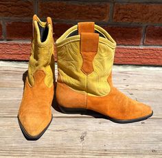 These vintage women's yellow and orange short cut western cowboy boots are slightly used in good condition. These suede material boots are a yellow and orange colour design in good condition. Pointed toe design, stitched soles with heels intact so you may enjoy these boots for a long time. Measurements: Label Reads: Not indicated ( Fits around a size 5 based on measurements)  Shaft Height: 8" Inches Calf Width: 6" Inches Heel Height: 1"  inches Length of Foot: 8 2/3" inches - Heel to ball of foo Yellow Western Boots With Round Toe, Cowboy Boots Vintage, 6 Inch Heels, Vintage Cowboy Boots, Boots Vintage, Boots Cowboy, Orange Colour, Vintage Cowboy, Colour Design