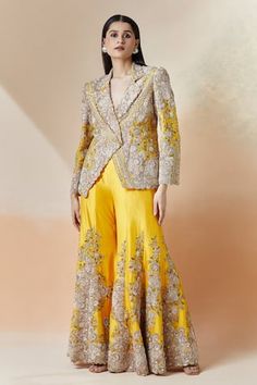 Kesar blazer with floral and zardozi embroidery all-over. Comes with coordinating sharara. - Aza Fashions Embroidered Peplum Anarkali Set For Wedding, Elegant Long Sleeve Lehenga With Gota Work, Fitted Embroidered Peplum Anarkali Set, Fitted Resham Embroidery Peplum Set, Yellow Long Sleeve Choli For Wedding, Yellow Long Sleeve Palazzo Set For Weddings, Fitted Peplum Set With Resham Embroidery, Fitted Peplum Sets With Dupatta, Elegant Fitted Nehru Jacket With Gota Work