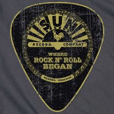 a black and yellow guitar picker with the words rock'n roll began on it