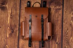 The Explorer is our first-ever leather backpack. Its structured satchel-style design makes it stylish for the workplace yet practical enough to answer the call of adventure. Boasting contrasting colours, adjustable shoulder straps and a double buckle closure, this classic bag will assist you in all your explorations! Size: 27 cm | 40 cm | 8 cm Weight: 1200 g It began in 2009 with a ball of wool and a crocheting needle in a Roma community in North West Romania where the Hungarian plain meets the Vegetable Tanned Leather Backpack For Travel, Leather Backpack With Leather Lining For Adventure, Daily Use Vegetable Tanned Leather Backpack, Waxed Finish Vegetable Tanned Leather Backpack, Everyday Vegetable Tanned Leather Backpack, Backpack With Leather Handles For Everyday Carry, Leather Handle Satchel Backpack For Everyday, Everyday Carry Backpack With Leather Handles, Adventure Leather Backpack With Adjustable Strap