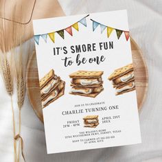 this is an image of a smore fun to be one birthday party card on a plate