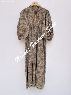 ITEM DESCRIPTION summer gray pattern printed women's maxi dress - V neckline cotton boho dress - buttons on sleeves maxi Features: 3/4th sleeve, V neck, Long dress Fabric : 100% Cotton Cambric hand block print fabrics  Sleeve Length = 22 inch For more sizes & their measurement, please refer our below chart to understand the sizes variations available with us For your size requirement, please mention your size in seller note at the time of buying. SIZE MEASUREMENT  BUSTLENGTHSHOULDER XXS34 inch51 inch13.5 inch XS36 inch51 inch14 inch S38 inch51 inch14.5 inch M40 inch51 inch15 inch L42 inch51 inch16 inch XL44 inch51 inch16.5 inch 2XL46 inch51 inch17 inch 3XL48 inch51 inch18 inch   Company Return Policy:  Please write for more information to my email directly CHOOSE "ASK SELLER QUESTION" Paym Bohemian Beige Printed Maxi Dress, Summer Gray Long Sleeve Maxi Dress, Gray Long Sleeve Maxi Dress For Summer, Gray Cotton Maxi Dress For Summer, Bohemian Gray Maxi Dress For Summer, Gray Floor-length Maxi Dress, Summer Bohemian Gray Dress, Gray Bohemian Summer Dress, Hippie Cotton Maxi Dress With V-neck