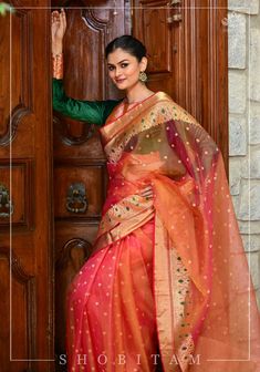 Nicknamed 'woven air' and handmade with fine yarns, this Chanderi silk saree is a sheer delight! Look at the intricately woven curvilinear borders that are decorated with a tingle of Meenakari green resham! The glow from this saree dual tone mustard pink saree is sure to spark your inner happiness! The saree is ready to wear with falls and pico done. An unstitched blouse fabric is included. *Note: There may be minor variations in the shade, the texture of the product. Hues/textures show differen Red Anarkali Dress, Pink Shot, Inner Happiness, Silk Saree Blouse, Natural Silk, Pink Saree, Banarasi Sarees