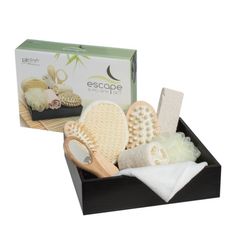 an assortment of hair care products in a black box with bamboo combs and sponges