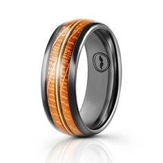 a wedding ring with wood inlays and an orange stripe on the inside of it