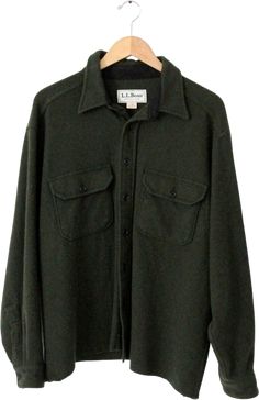 This is a LL Bean fleece shirt jacket. Soft forest green fleece shapes the warm button down shirt. A great cool weather jacket and warm layering piece.• LL Bean• fleece shirt• dark green• button downCONDITIONIn good condition with wear consistent with age and use. There is home made tailoring at the bottom hem. The shirt was shortened and has a slightly uneven cut. MARKED SIZE: XLMEASUREMENTSBust: 53" ... 134. 6 cmLength: 27" ... 68. 6 cmShoulders: 22" ... 55. 9 cmNeck to Sleeve End: 36" ... 91. 4 cmOutside Sleeve: 24" ... 61 cmHOW WE MEASURE• Shirt measured lying flat• Bust measured armpit to armpit. Doubled for size• Length measured down center of the back. • Shoulders measured between the shoulder seam• Outside Sleeve measured from shoulder seam to end of sleeve on outside of arm. • Nec Outdoor Long Sleeve Shacket With Buttons, Long Sleeve Shacket With Buttons For Outdoor, Collared Green Shacket For Winter, Dark Green Long Sleeve Outerwear With Pockets, Dark Green Long Sleeve Outerwear For Fall, Green Winter Shacket With Pockets, Green Long Sleeve Winter Shacket, Green Long Sleeve Shacket For Winter, Green Buttoned Tops For Outdoor